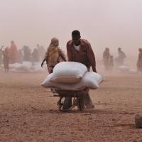 A Somali pastoralist with food ration bags