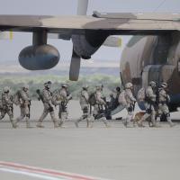 Soldiers boarding a combat aircraft